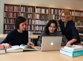 Art+Feminism Wikipedia Edit-a-Thon - women working in Hirsch Library on laptop